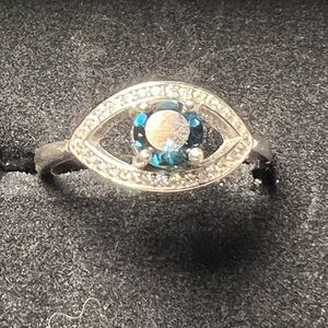 Sterling silver level eye ring with blue topaz and moissanite size 9.5